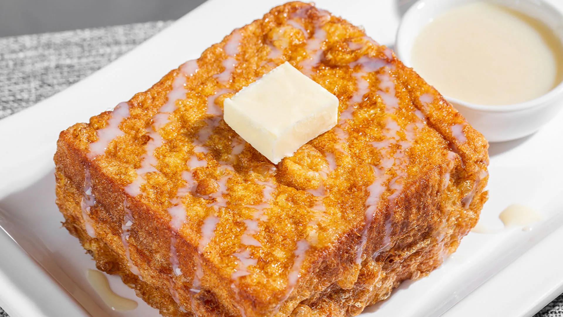 Classic Hong Kong french toast with butter cube and sweet condensed milk at Smile House Cafe, a Hong Kong Style Fast Food Restaurant in San Francisco